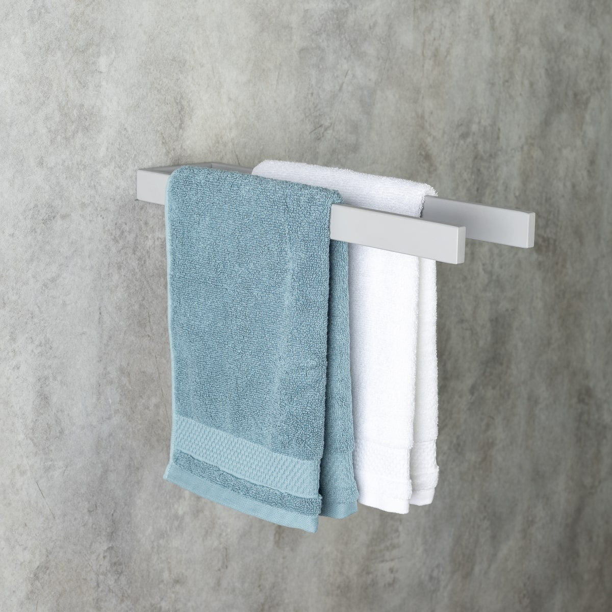 gray wall-mounted towel holder, side view, holding two towels, suitable for face and hand towels, modern bathroom accessory